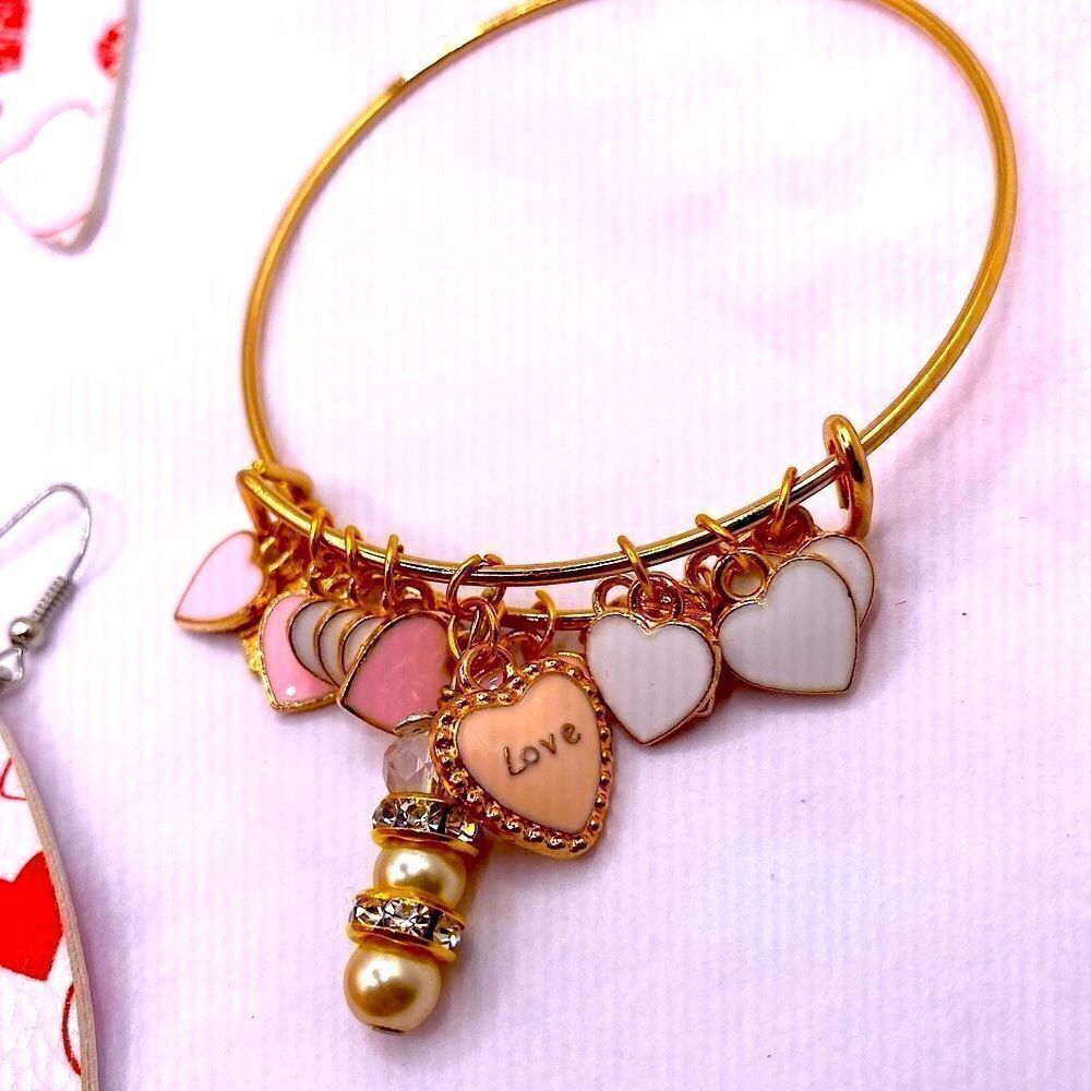 Pink and gold valentine’s day adjustable bangle charm bracelet and earrings set.